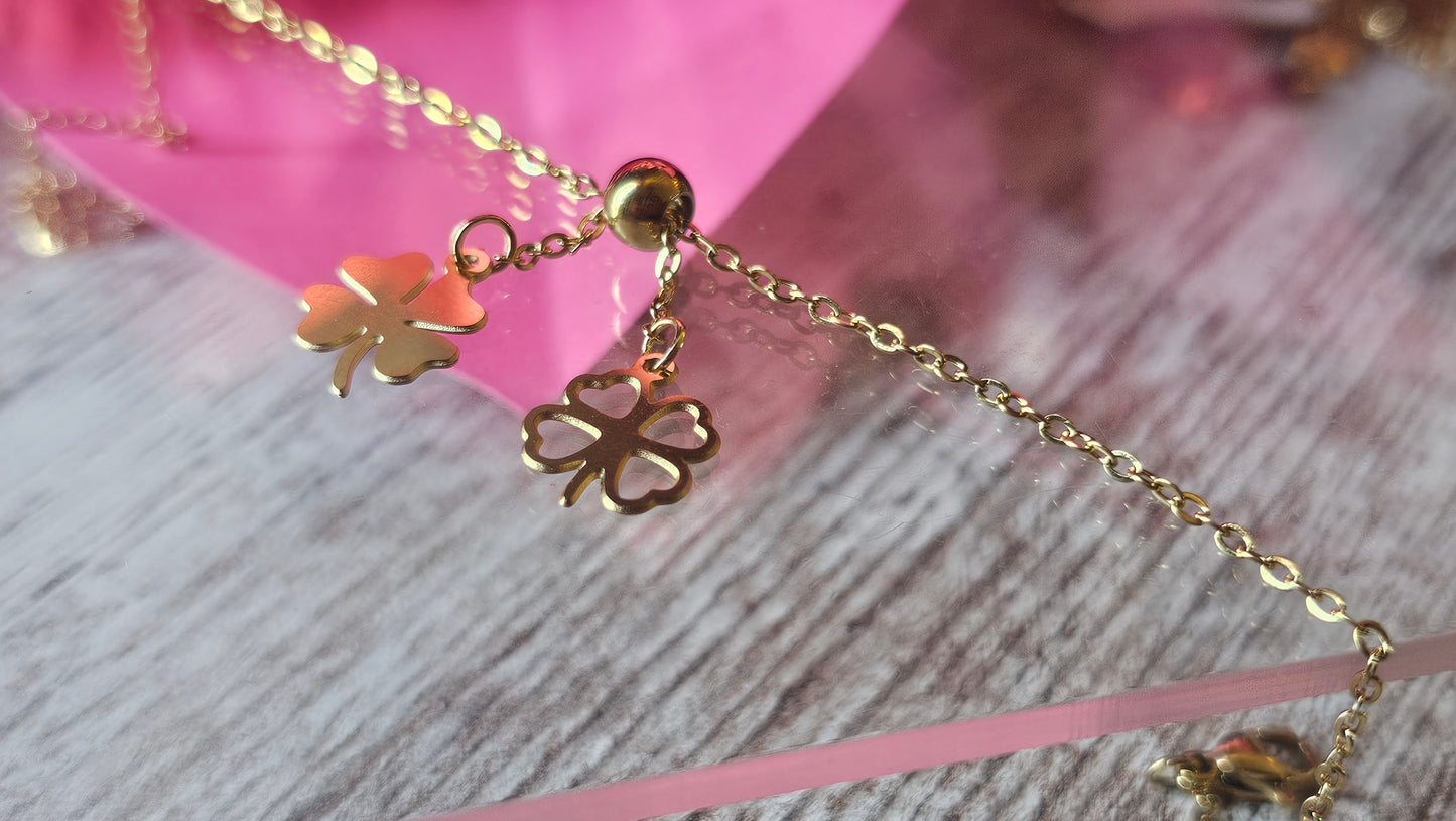 Chevillière en acier inoxydable avec pendentifs trèfles